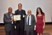 Fr. Dr. Joseph Laracy receiving the certificate and the medal of his designation as "Inter-Disciplinary Communication" Fellow of the IIIS.